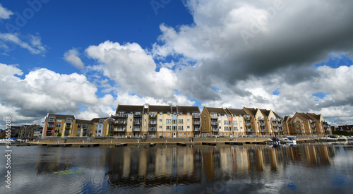 Marina Apartment blocks with big bright cloudy sky and reflections photo