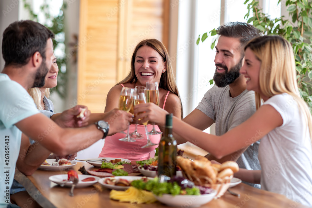 Group of friends have fun while have lunch together. Group of friends have fun while have lunch together.