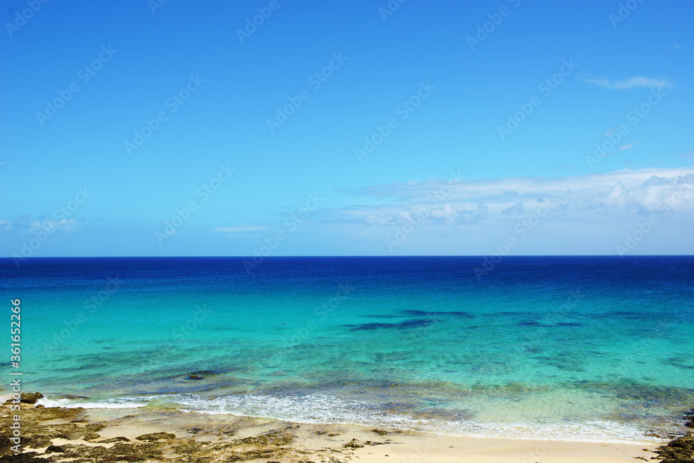 Tropical beach, azure ocean water and blue sky. Paradise landscape. Tropical beach, azure ocean water and blue sky. Paradise landscape.
