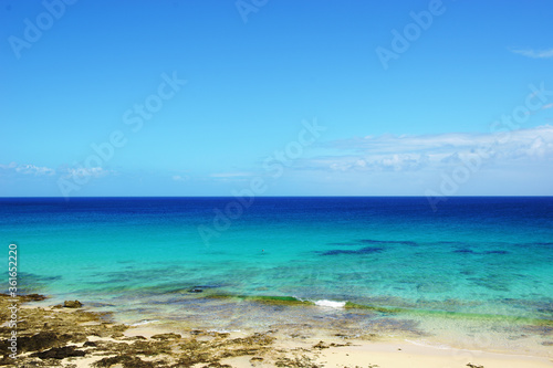 Tropical beach, azure ocean water and blue sky. Paradise landscape. © Dmitry Tsvetkov