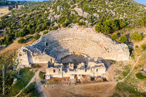 Patara (Pttra). Ruins of the ancient Lycian city Patara. Amphi-theatre and the  assembly hall of Lycia public. Patara was at the Lycia (Lycian) League's capital. Aerial view shooting. Antalya, TURKEY photo