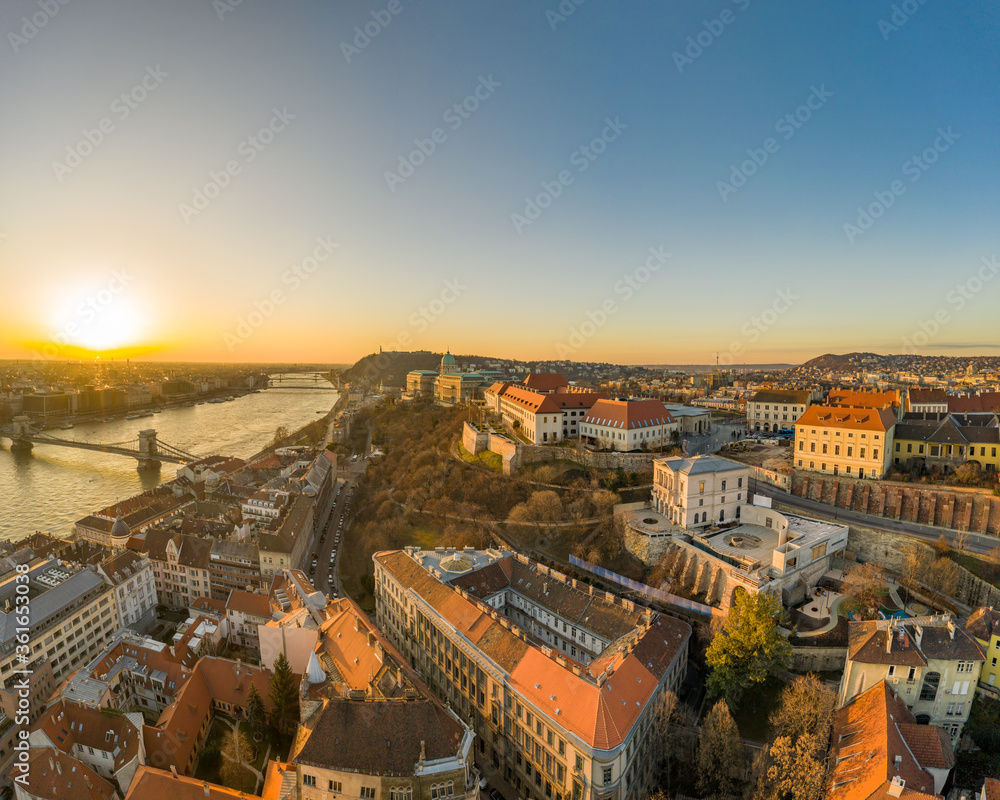 Naklejka premium Aerial drone shot of Buda castle on Buda hill during Budapest sunrise morning glow