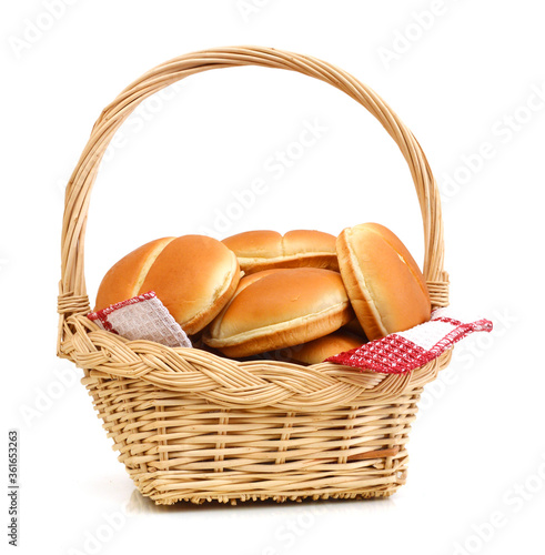 Bakery products in basket with towel