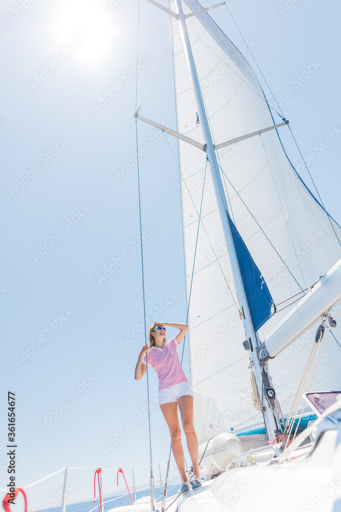 Fototapeta premium Beautiful Girl relaxing with On Yacht in Greece
