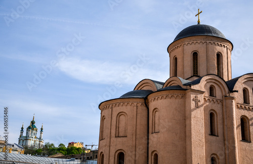 
View at Church of Assumption of the Virgin Mary Pirogoscha on Kontraktova Square and St. Andrew s church on background in Kyiv, Ukraine photo