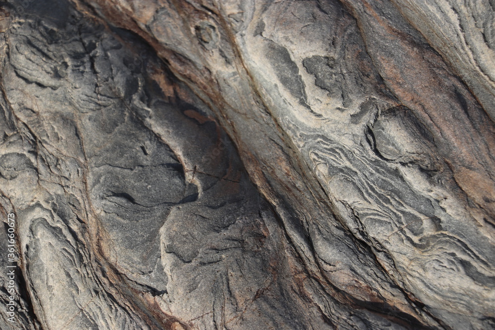 Intricately patterned rock light grey and orange Intricately patterned rock light grey and orange