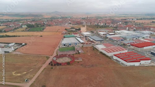 Aerial view of bullring  and fields in village of  Spain. Drone Footage