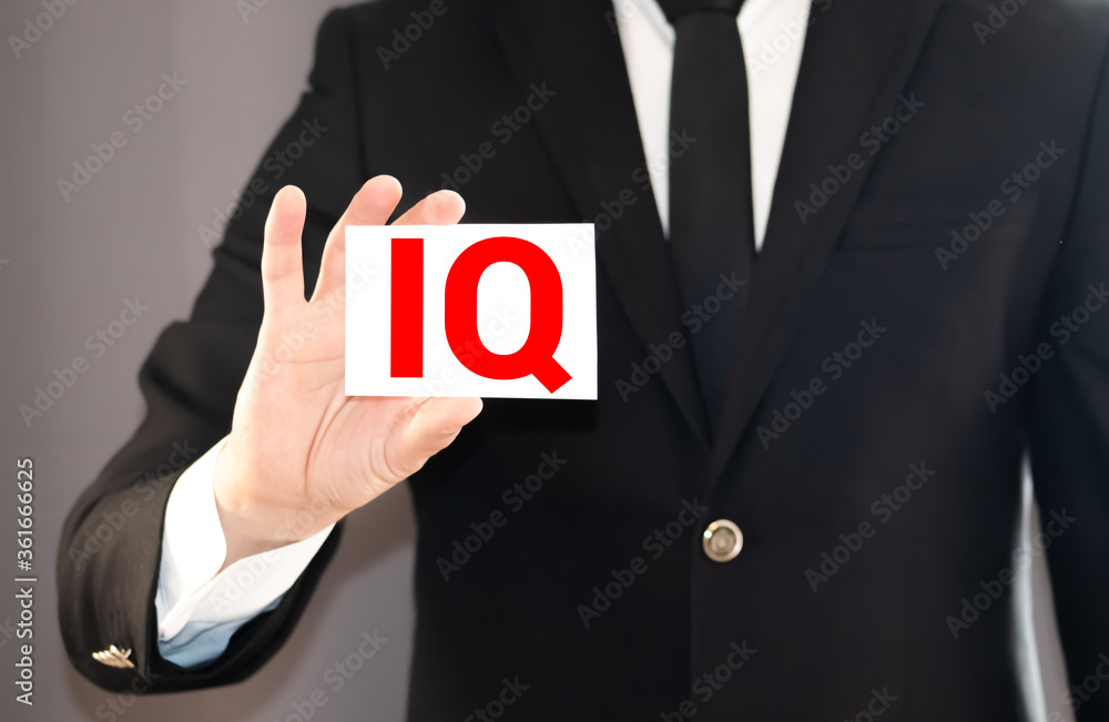 IQ word concept on wooden cube. Intelligence symbol. Brain or talent background. IQ word concept on wooden cube. Intelligence symbol. Brain or talent background.