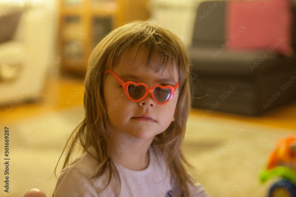 toddler playing with glasses