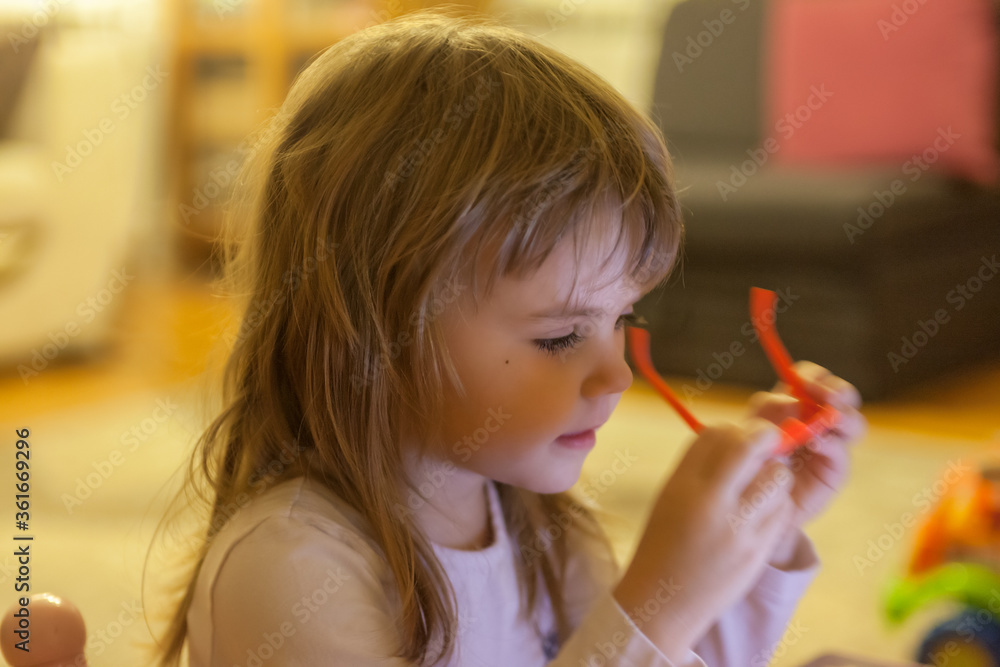 toddler playing with glasses
