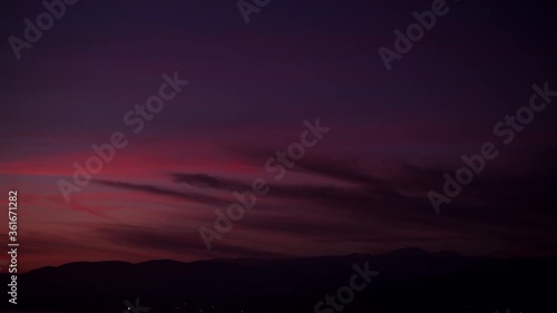 Time lapse of sunset and nightfall over Sierra Nevada mountain range in Spain. Nature landscape