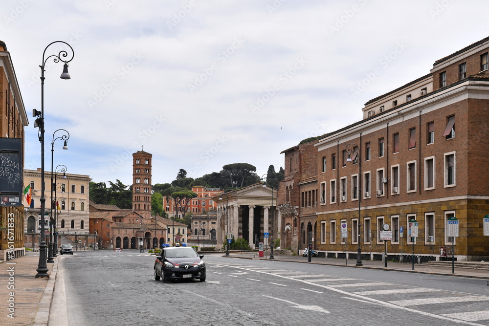 Rome May 1st 2020: Petroselli street deserted just a police car no pedestrians 