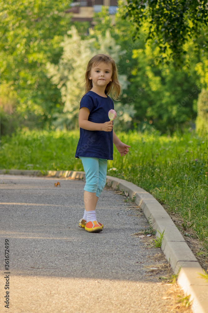 Fototapeta premium little girl eating ice cream
