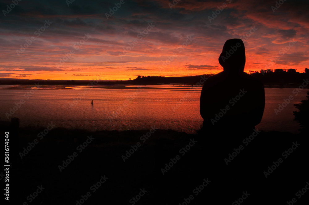 Silhouette on sunset in Bay of Plenty, New Zealand