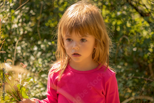 Wallpaper Mural little girl picking up a flowers Torontodigital.ca