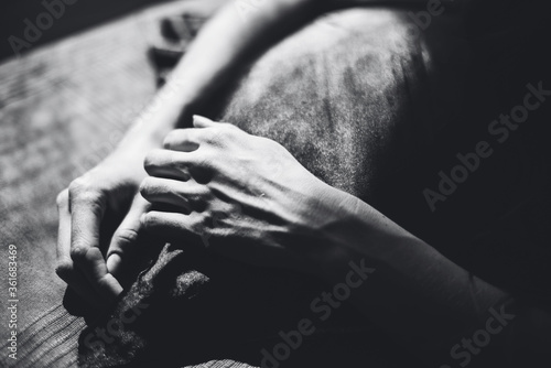 Black and white image of a girl's hands