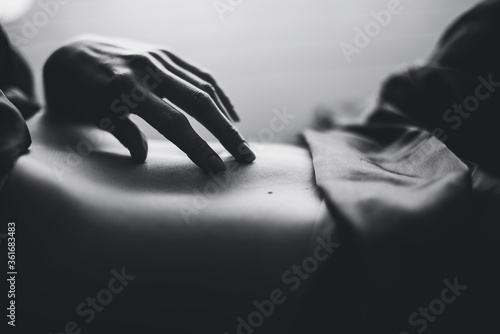 Fototapeta Naklejka Na Ścianę i Meble -  Black and white image of a girl's hands