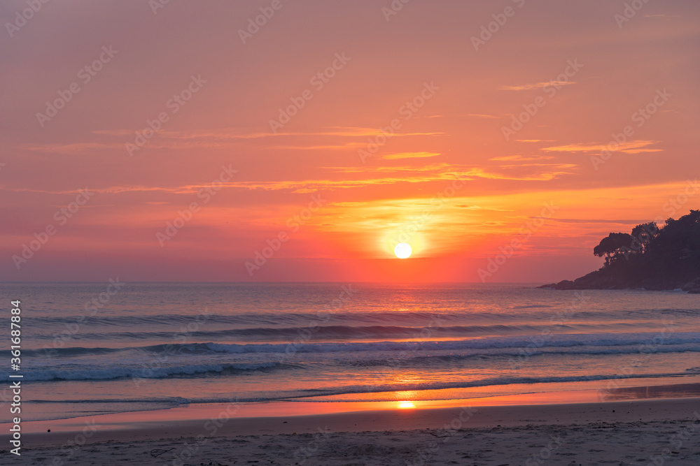 .The sun fell on the horizon in the sea at Karon beach Phuket.