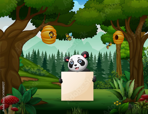 Panda holding a blank sign in the park