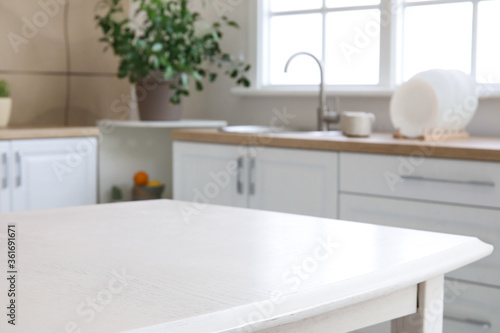 Dining table in interior of modern kitchen