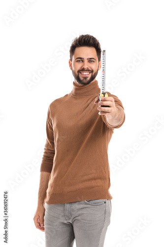 Young man with measuring ta...