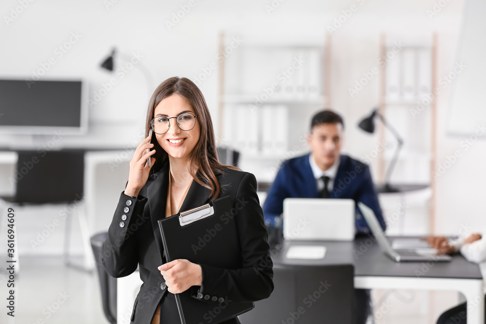 Young businesswoman working in office Young businesswoman working in office