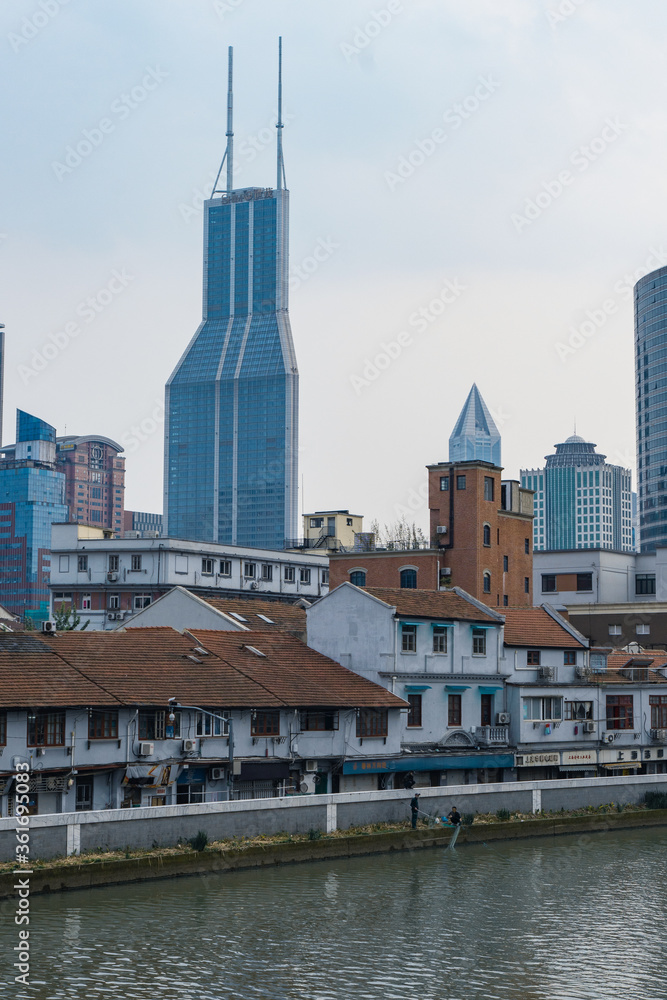 Modern and historic buildings along the Suzhou River, in Shanghai, China.