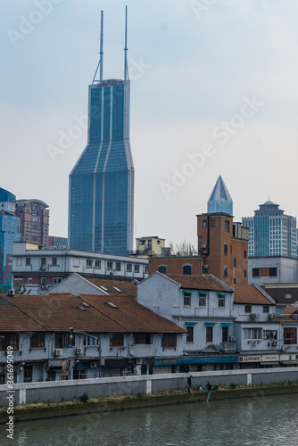 Modern and historic buildings along the Suzhou River, in Shanghai, China.