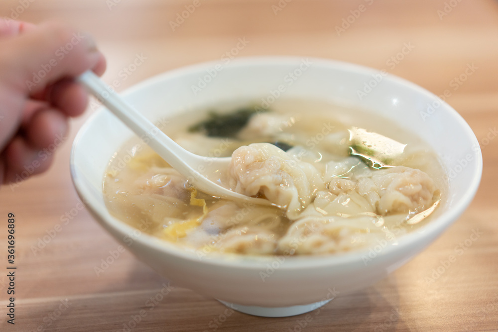 Wonton soup, Chinese traditional food with boiled meat filled wonton and seaweed soup. Wonton soup, Chinese traditional food with boiled meat filled wonton and seaweed soup.