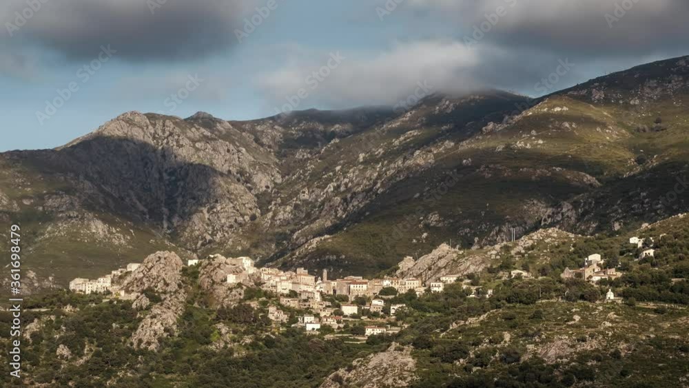 Day to night time-lapse of clouds passing and night falling over the village of Speloncato in Corsica Day to night time-lapse of clouds passing and night falling over the village of Speloncato in Corsica