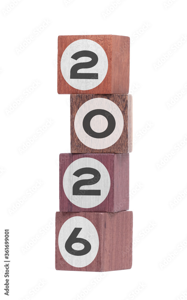 Four isolated hardwood toy blocks, saying 2026