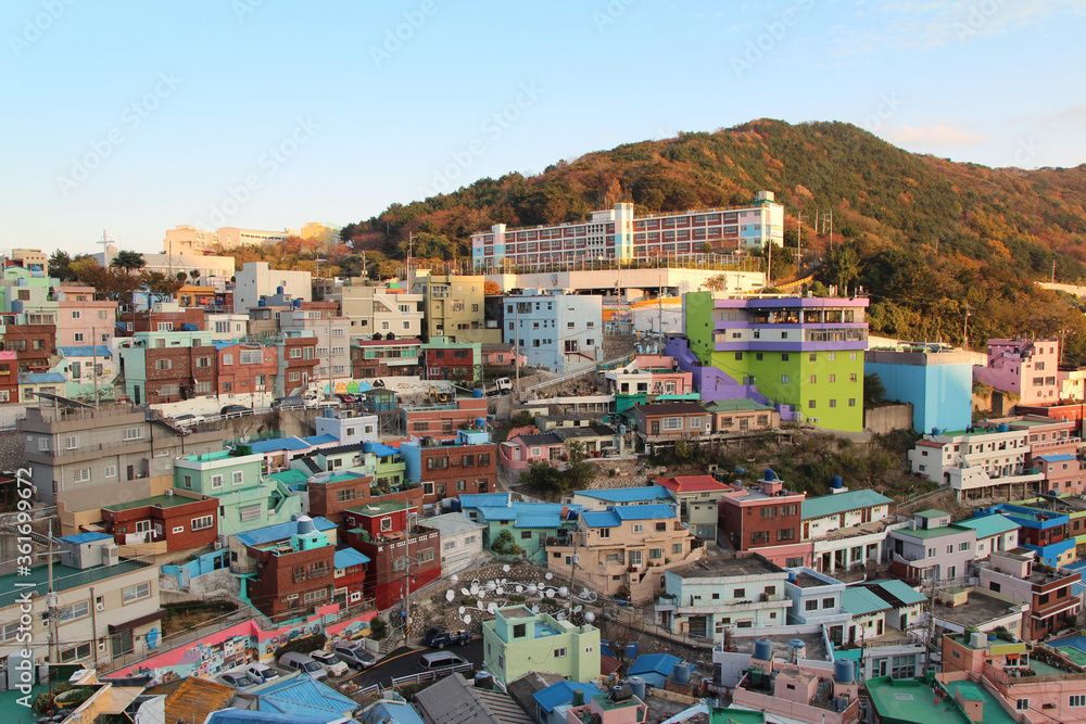 Gamcheon Culture Village which is houses built in staircase-fashion on the foothills of a coastal mountain during sunset in autumn, Busan, South Korea