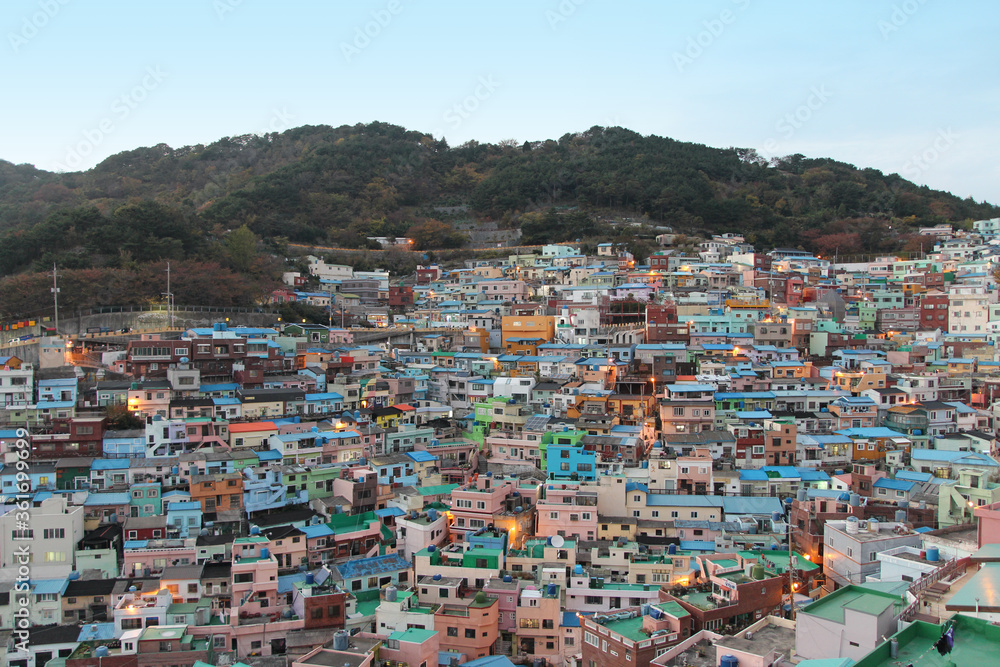 Gamcheon Culture Village which is houses built in staircase-fashion on the foothills of a coastal mountain during sunset in autumn, Busan, South Korea