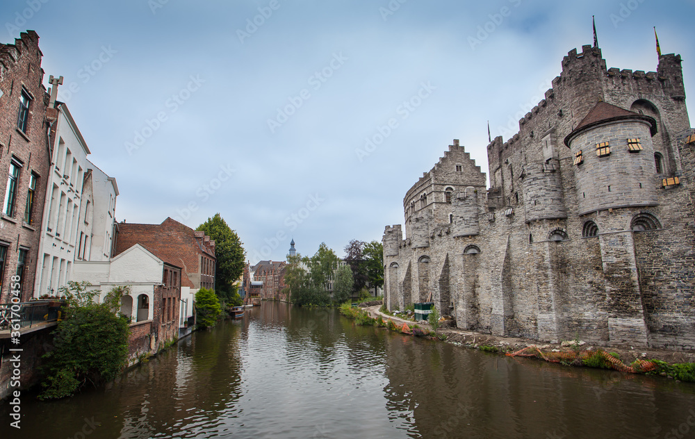 View of Gravensteen castle and Ghent canal. Architecture and landmark of Ghent Belgium