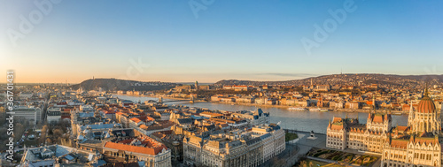 Panoramic aerial drone shot of Danube river with Buda castle and Hungarian Parliament in Budapest