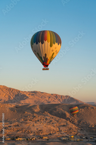 Hot air Balloons over Valley of the King in Luxor city in a morning sunrise, Upper Egypt © skazzjy