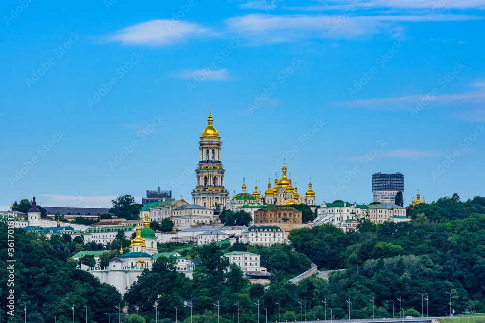 View on buildings of the Kiev Pechersk Lavra and Great bell tower from left bank of river Dnieper in Kiev, Ukraine