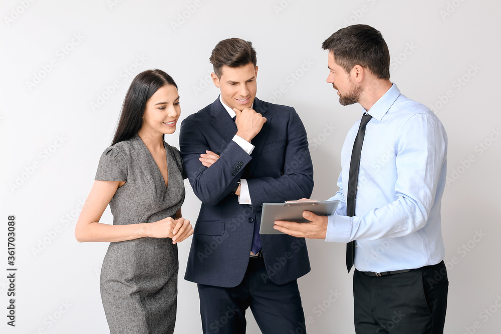 Group of business people on light background Group of business people on light background