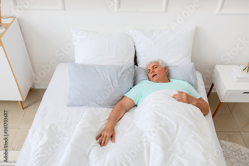 Mature man snoring while sl...