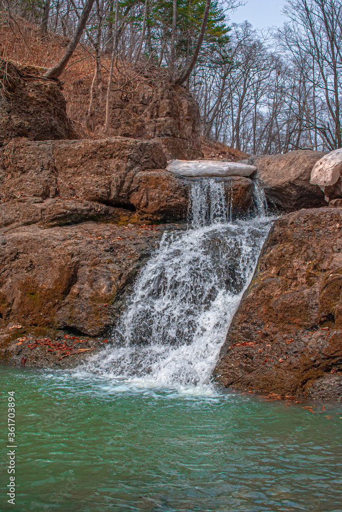 Naklejka premium waterfall in the forest