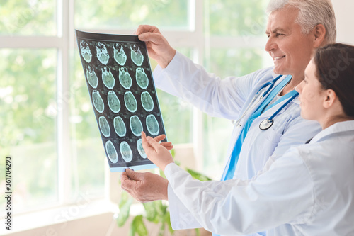 Senior neurologist and assi...