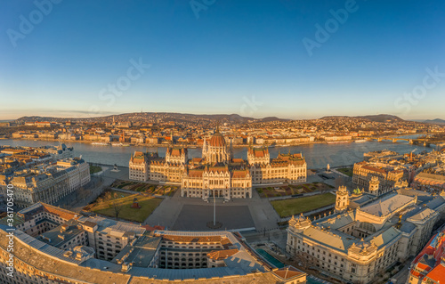 Aerial drone shot of east side facade of Hungarian Parliament Kossuth Square during Budapest sunrise © Davidzfr