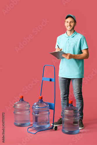 Delivery man with bottles o...