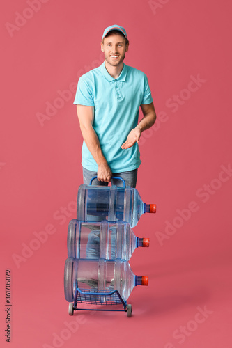 Delivery man with bottles o...