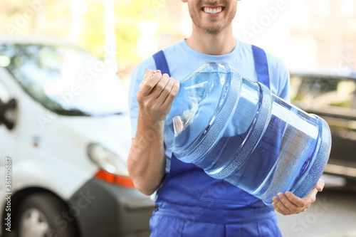 Delivery man with bottle of...