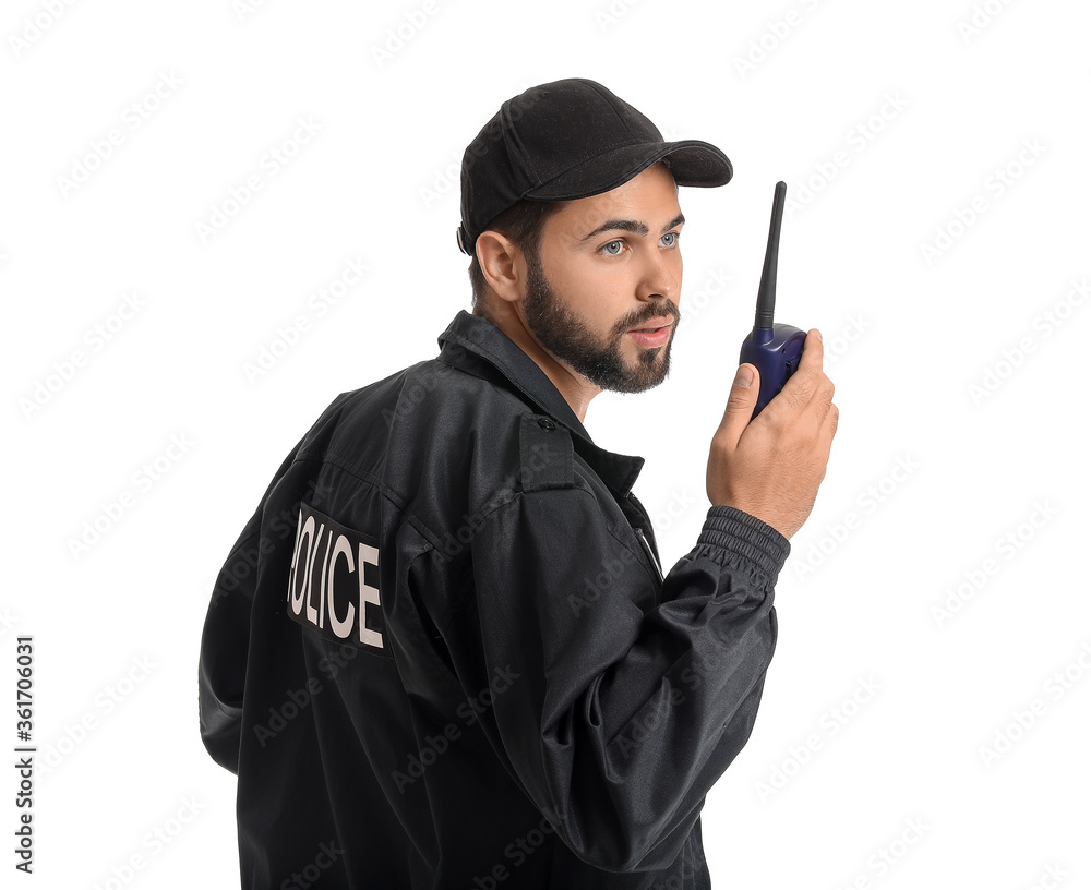 Handsome policeman with two-way radio on white background Handsome policeman with two-way radio on white background