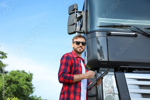 Male driver with clipboard ...