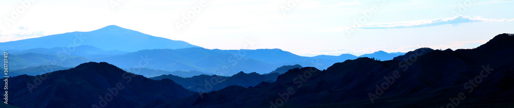 Sunset in the mountains. South Siberia. The Republic of Khakassia. Panorama.