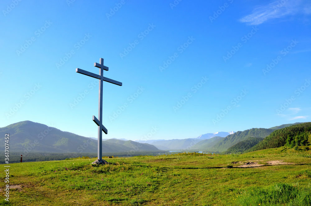 Poklonniy cross on the place of the Cossack outpost of the XVIII and XIX centuries to protect the state border of the Russian Empire. Mountain cross. Sayanogorsk. The Republic of Khakassia. Poklonniy cross on the place of the Cossack outpost of the XVIII and XIX centuries to protect the state border of the Russian Empire. Mountain cross. Sayanogorsk. The Republic of Khakassia.