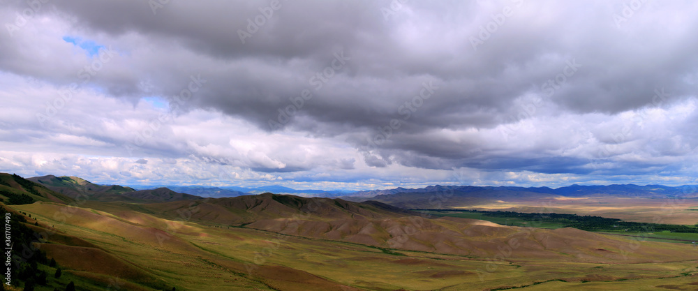 View of the hills. Mountain-steppe landscape with clouds. South Siberia. The Republic of Khakassia.